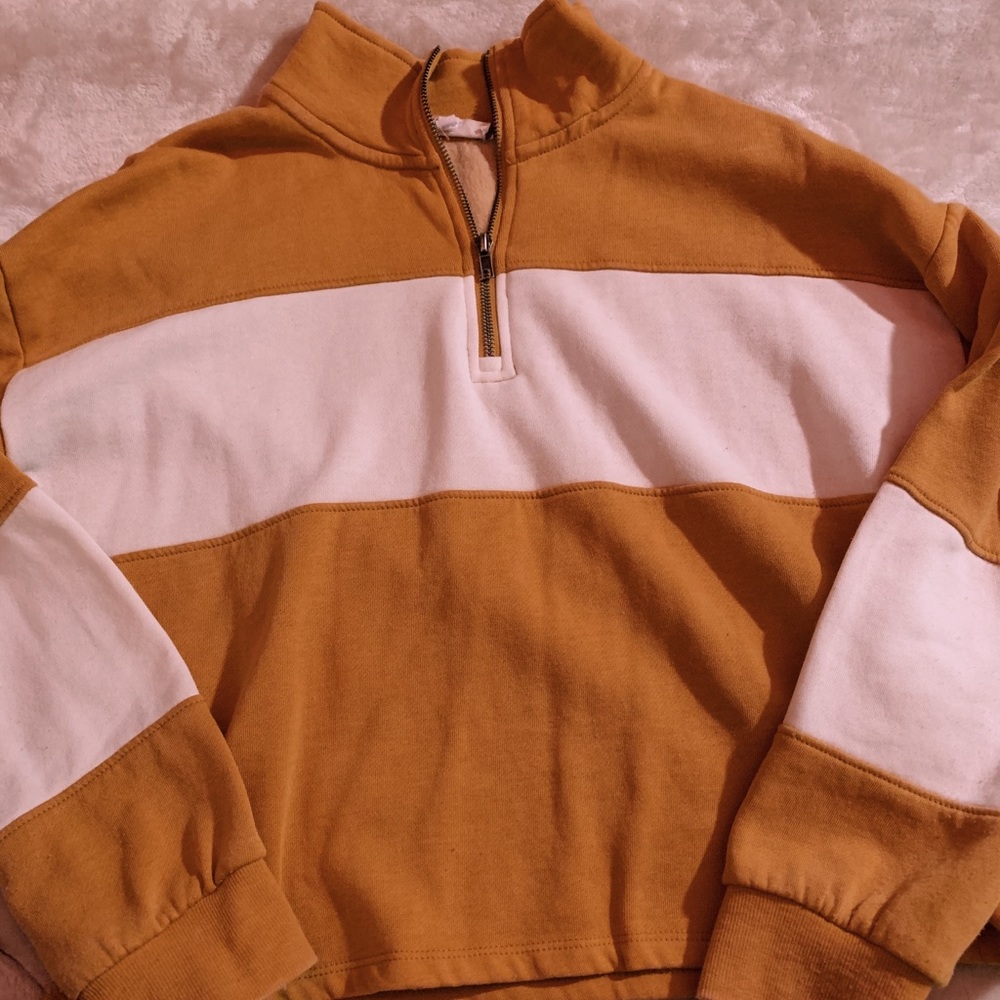 gold and white quarter zip